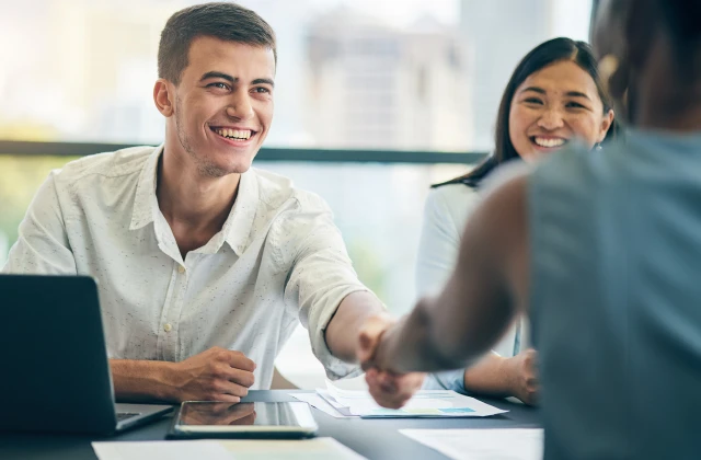 A person smiling at another person